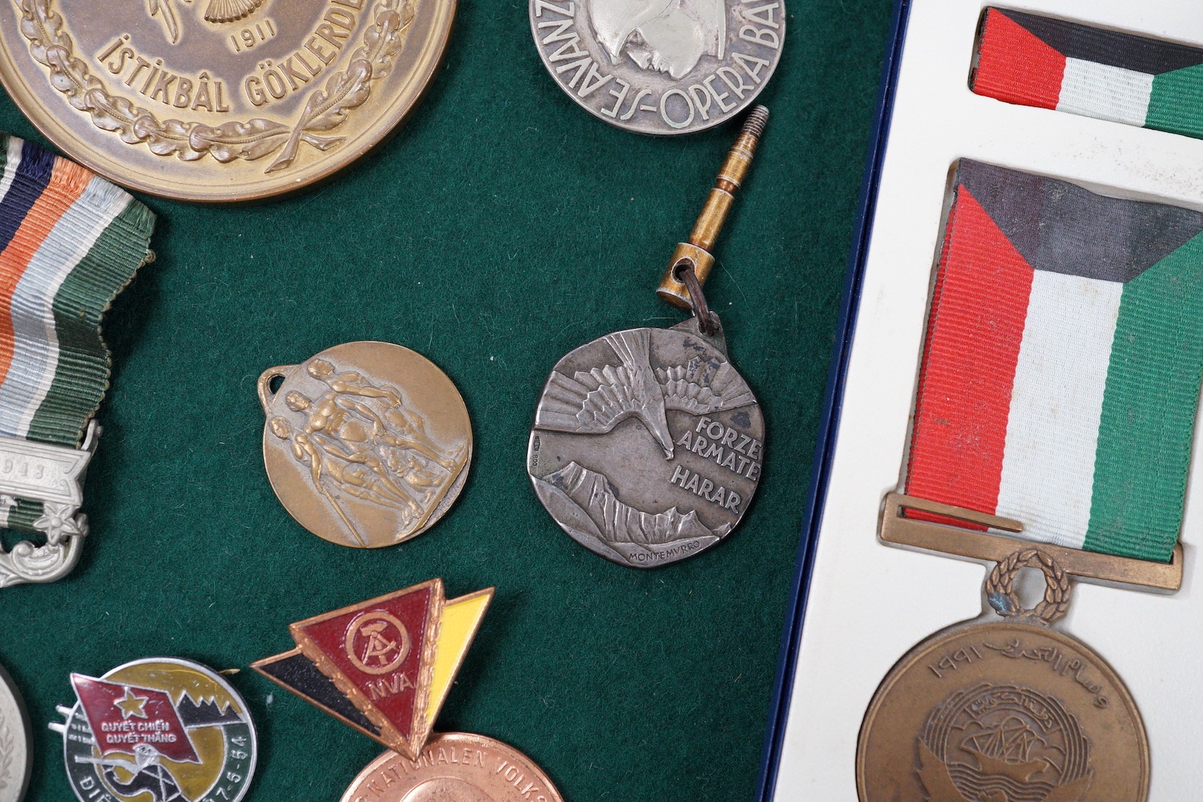 Foreign medals - Pakistan GSM with Kashmir 1948 clasp, two Liberation of Kuwait medals, Saudi Arabia and Kuwait issues, East German reserve medal, Italian Ethiopia Campaign 1937 medal, ONB badge and Combattimento medal,